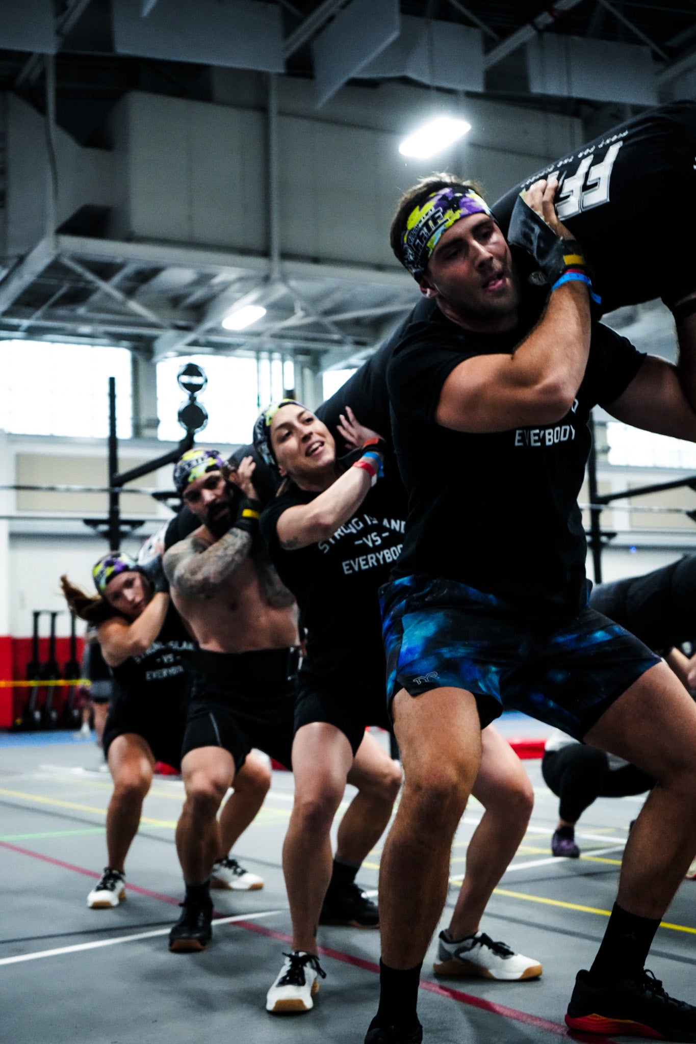 "The 4-Person Worm in action at Fight for the Fittest, pushing athletes to improve teamwork and strength in high-stakes competition."
