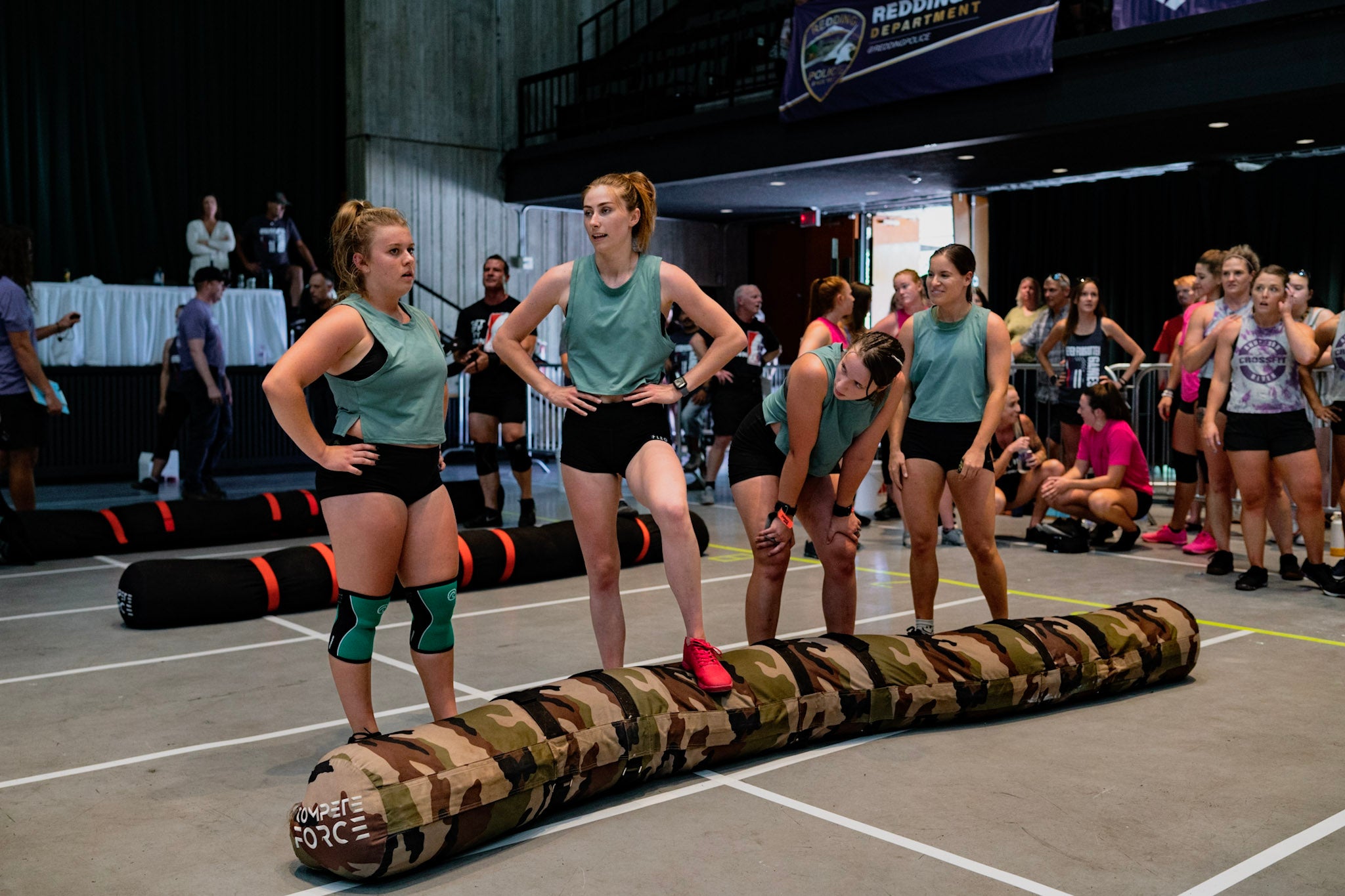 "Competing with the 4-Person Worm at FitFest, pushing teamwork and functional strength through intense team exercises."