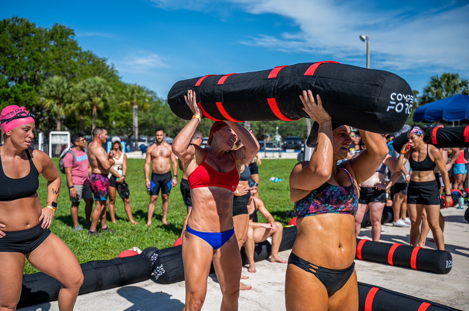 "Wod-Wars competitors lifting the 2-Person Worm, demonstrating the power of effective team training for victory."