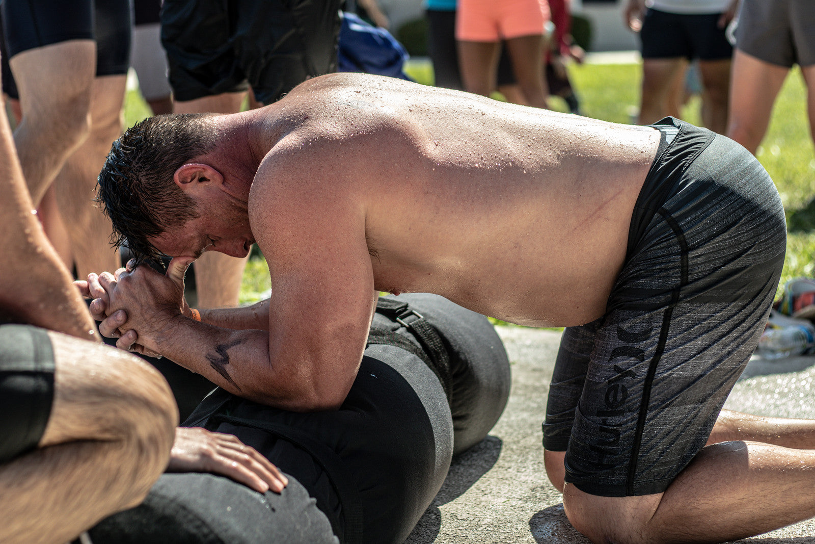 "Athletes lifting and moving the 150lb 2-Person Worm at Magic City Games, a key tool for enhancing coordination and communication in competitive settings."