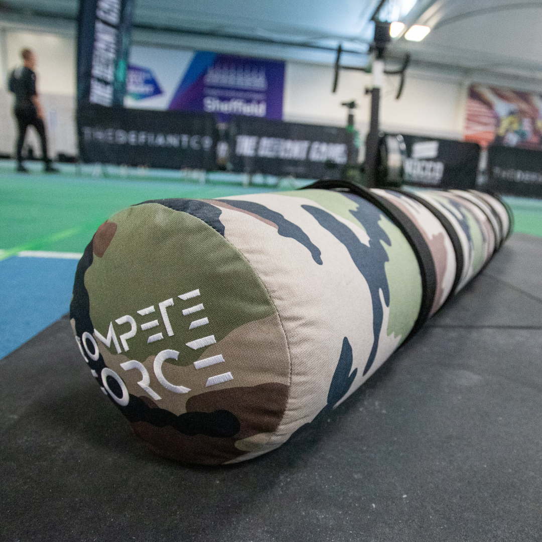 "Athletes using the 150lb 3-Person Female/Scaled Worm at The Fittest Experience, elevating performance with improved teamwork and coordination."