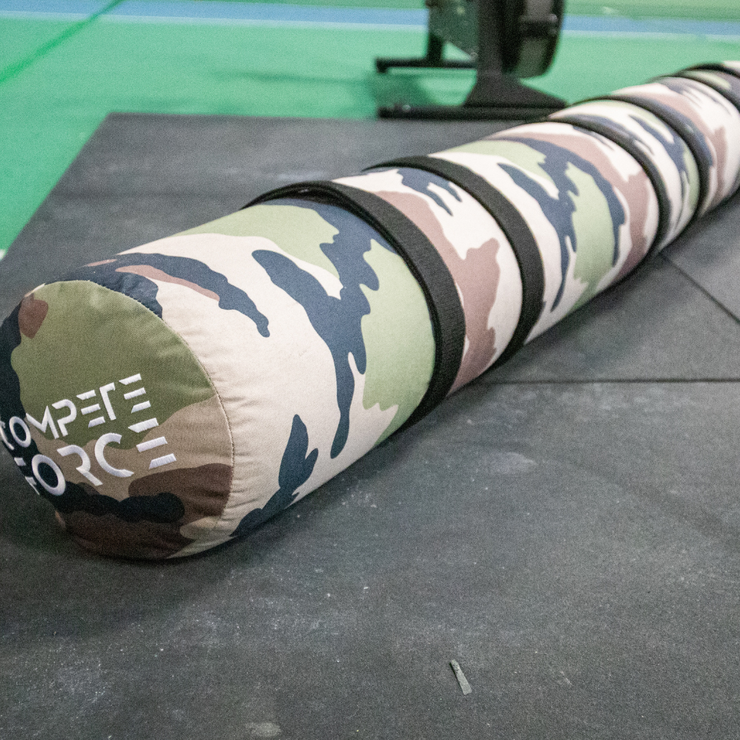 "Training with the 150lb 3-Person Female/Scaled Worm at KointheOK, strengthening communication and stamina for high-intensity workouts."